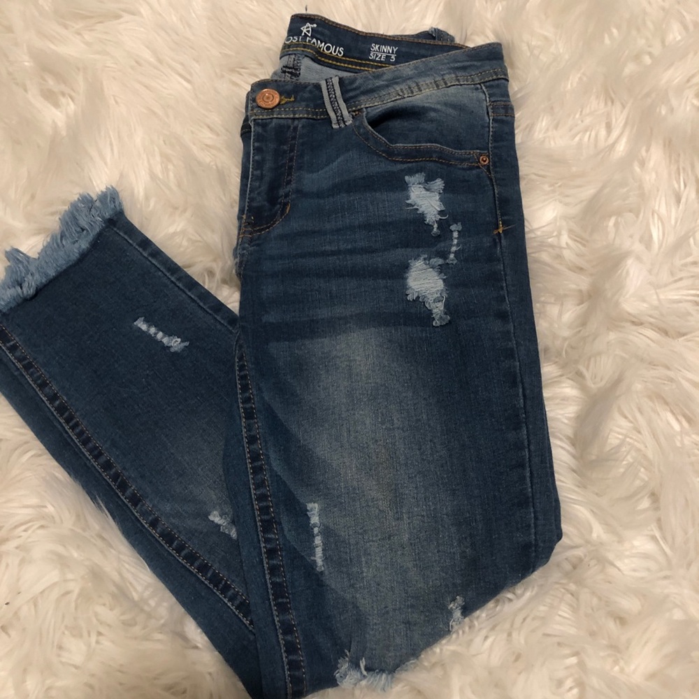 Medium wash ripped jeans.